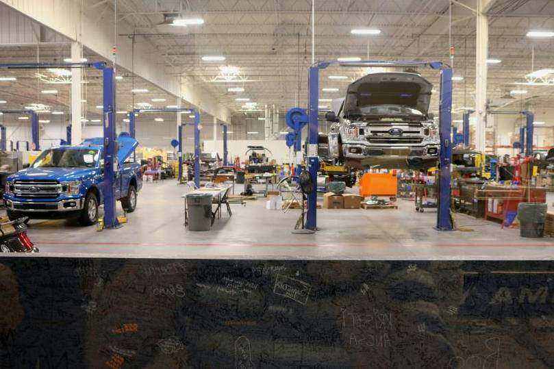 Technician working under car