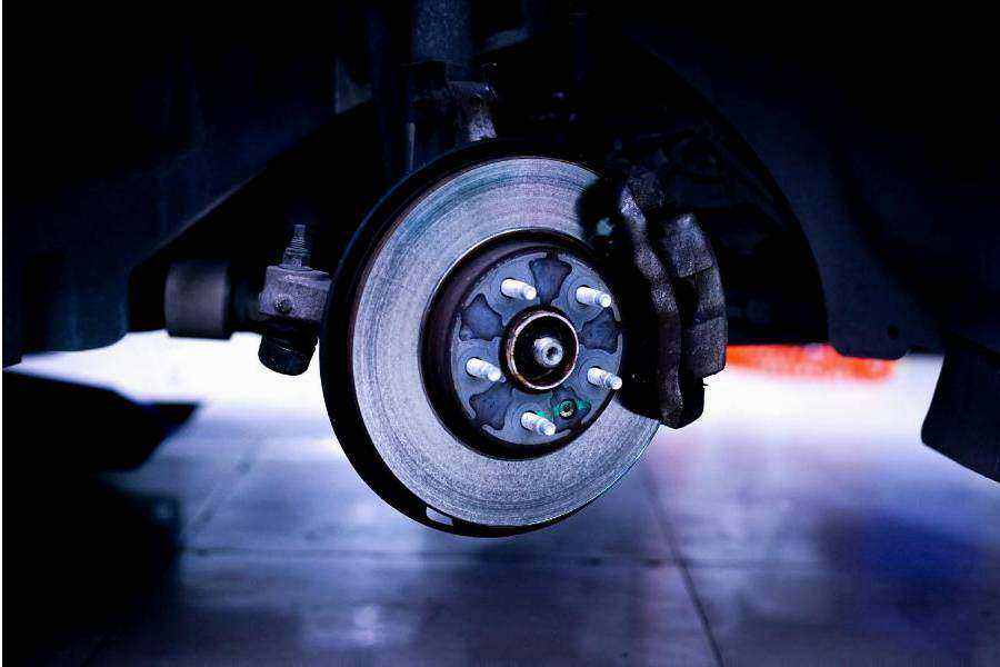 Technician preparing car for roadworthy inspection